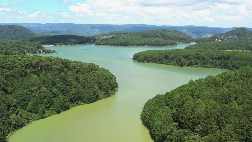Aerial view of river and lush green landscape during the day