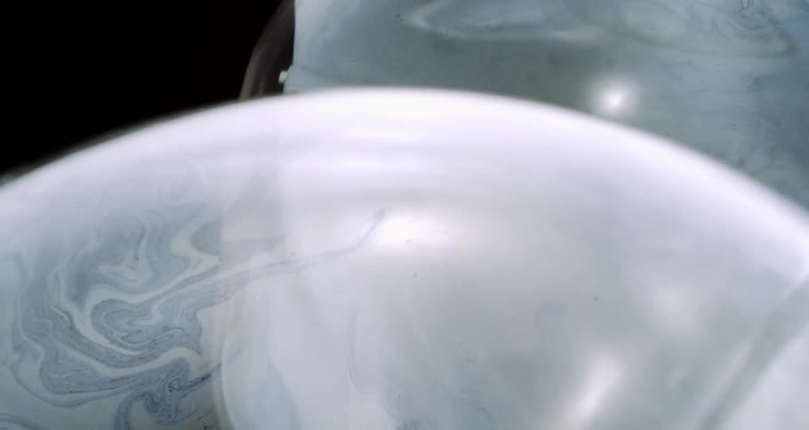 One of the bubbles floating around pops