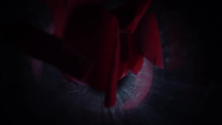Extreme closeup of a hole emitting rose petals in slow motion