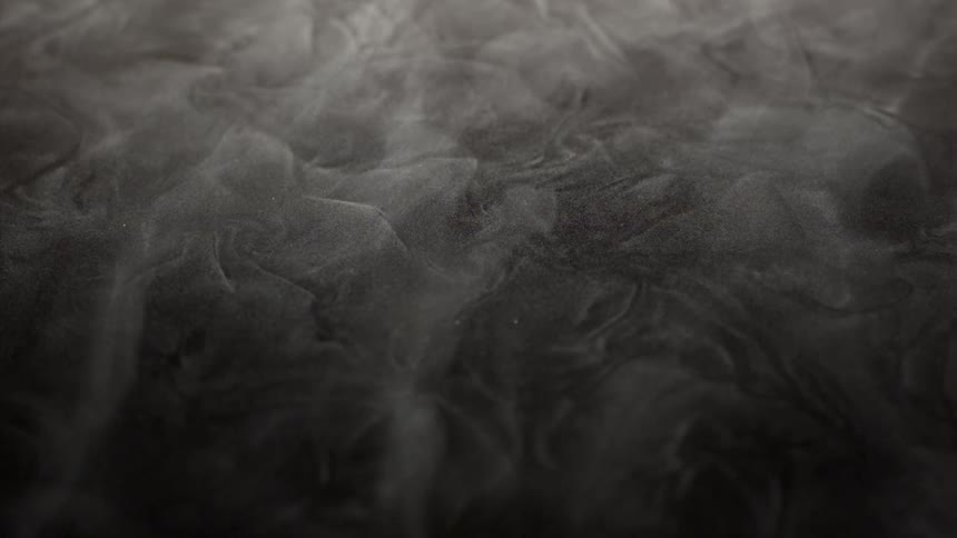 Extreme closeup of dense smoke in slow motion