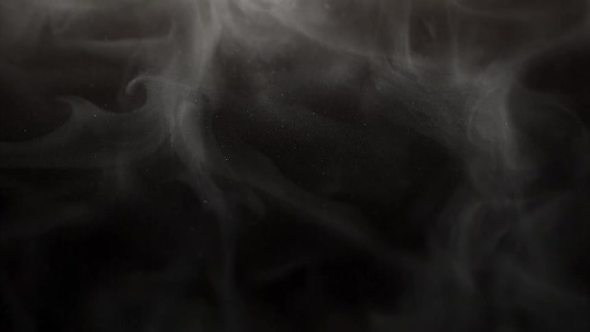 Smoke rises and spreads in the darkness