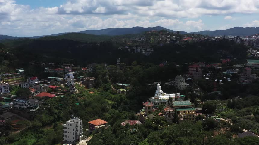 Aerial view of the giant statue on the kannon pagoda of da lat