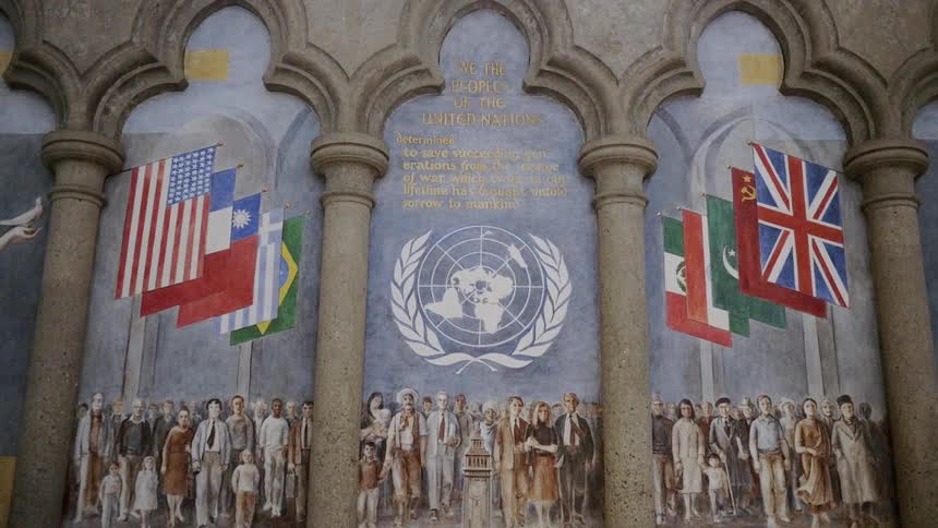 A mural covers a pillared wall