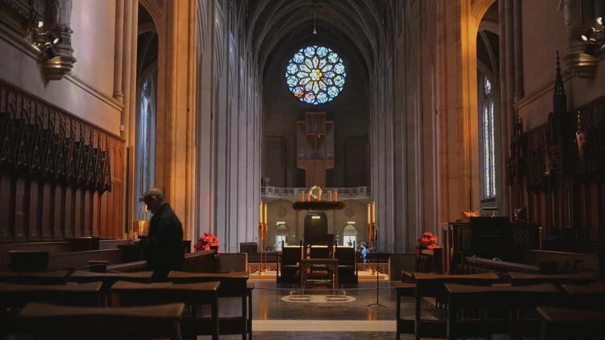 A man in a church walks away