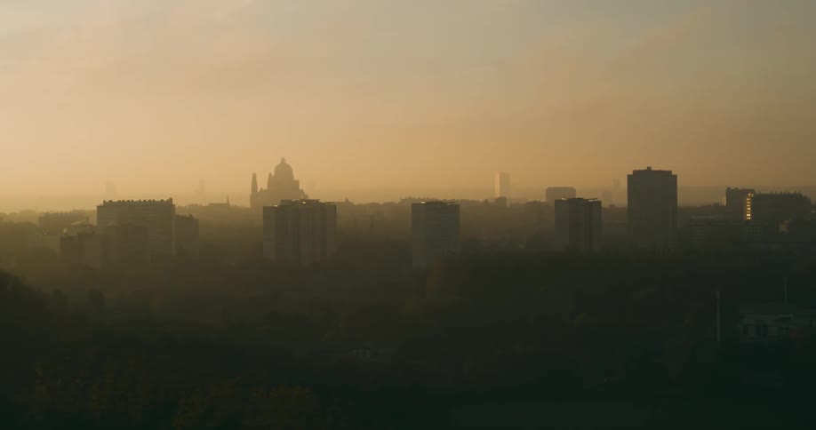 Skyline of a foggy city during dawn