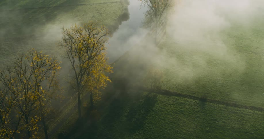 Aerial of a plain during dawn with fog