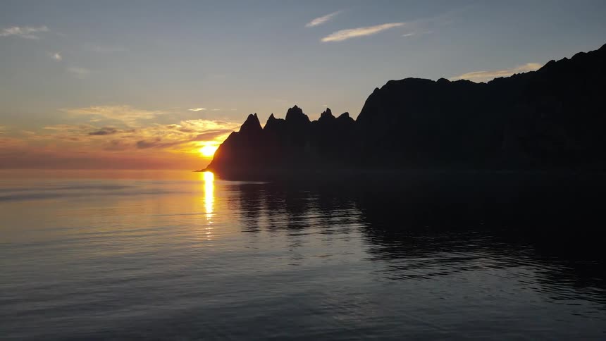 View of the sea coastline and the sun rising on the horizon