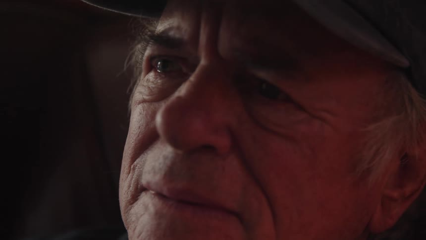 Sad elderly mans face wearing a baseball cap