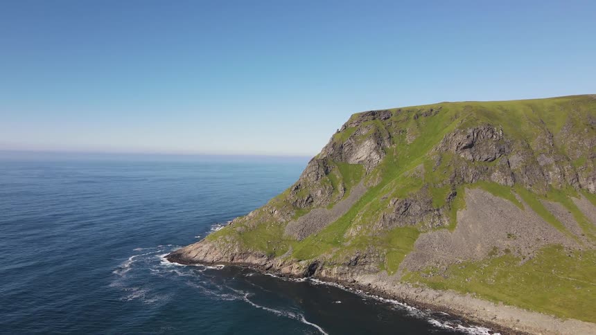 Aerial panorama of the sea with the coastline on a cloudless day with a blue sky