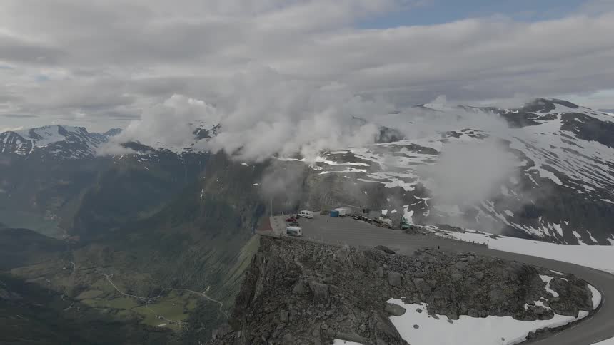 Aerial view of cars parked on a lookout in the mountains