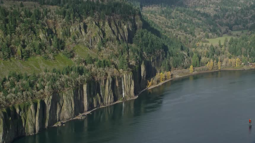 Aerial panorama of mountain cascades with waterfalls by the sea