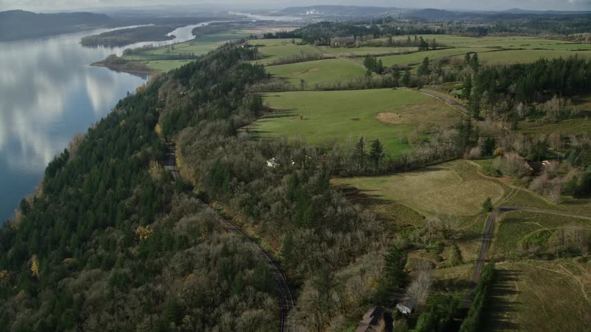Aerial view of fields in the countryside next to a river