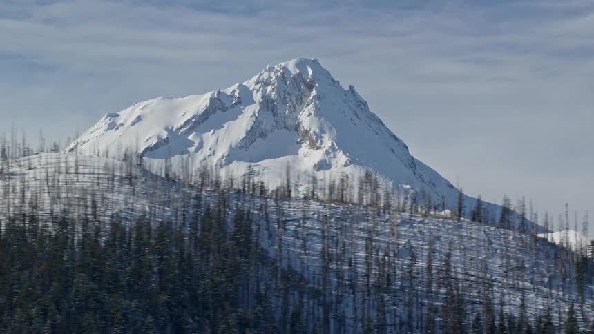 Aerial view of high snowy mountain peak