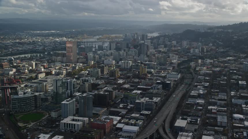Aerial panorama of a metropolis on the edge of lakes in the morning