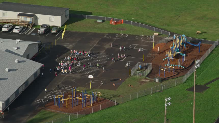 Aerial panorama of children playing during recess on an outdoor school playground