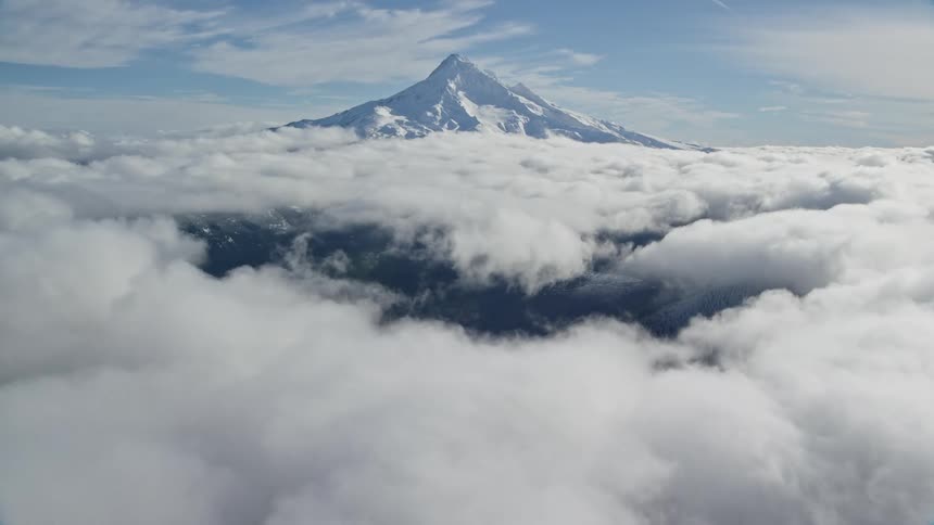 Aerial view of a mountain peak over the mountains