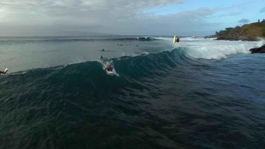 People surfing in a body of water
