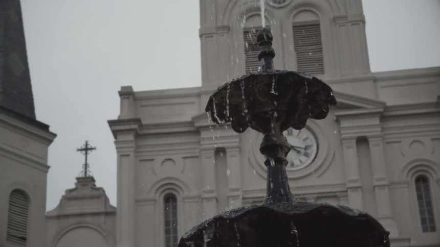 A large fountain is in front of this building