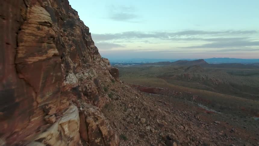 A large canyon lines the area at sunset