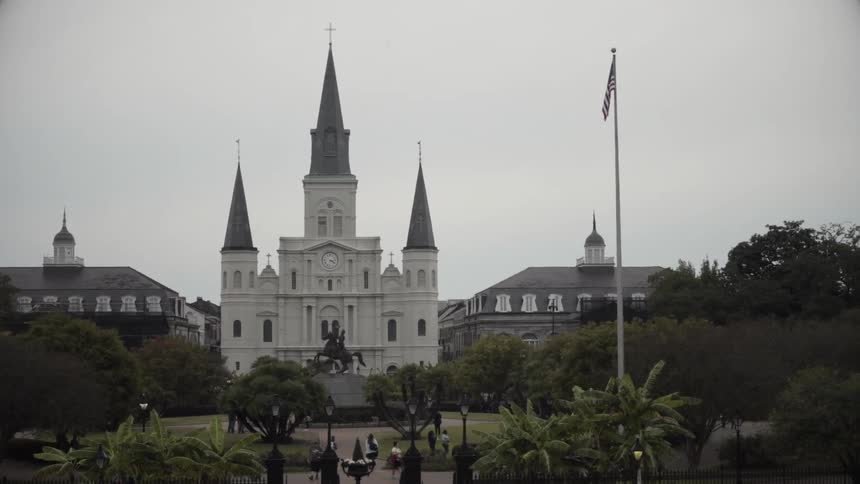 An elaborate church like building on a cloudy day