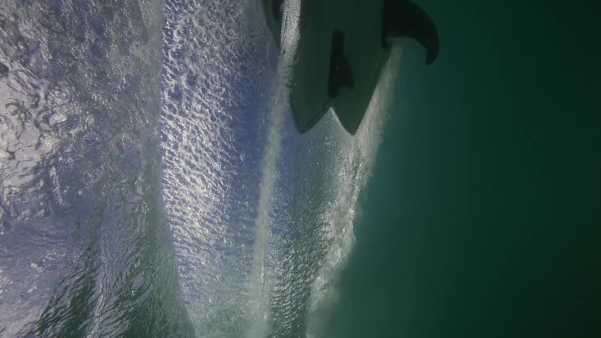 A man is riding a surfboard