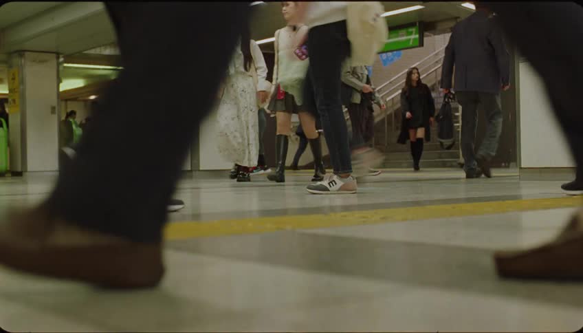 People walking inside a metro station