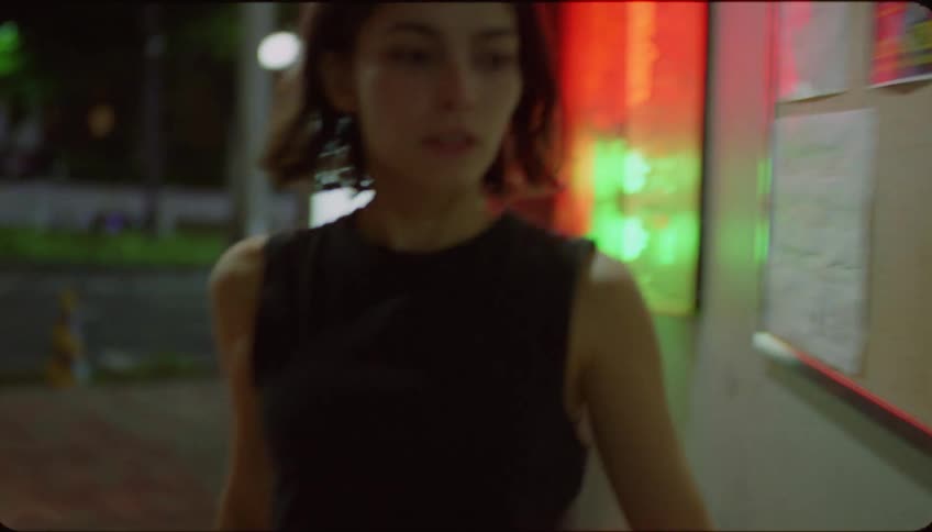 A woman running to enter a nightclub