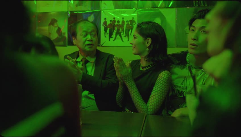 Portraits of friends and an elderly person at a pub table at night