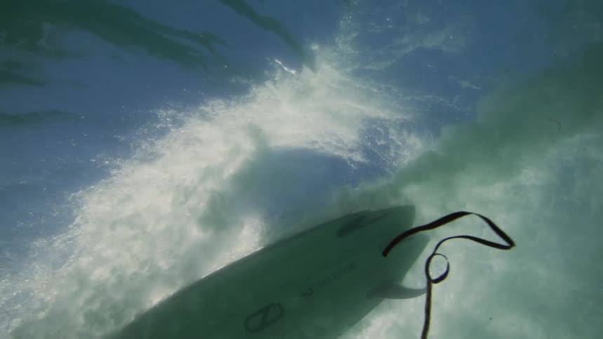 A board going underwater to cross a wave