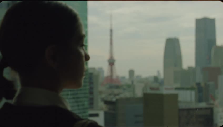 Portrait of a woman looking at a metropolis then turning around and walking away