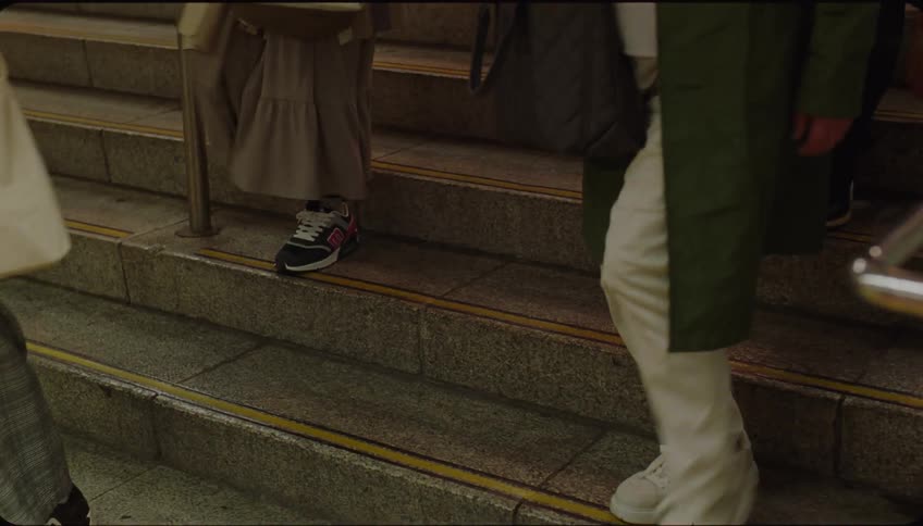 Closeup of peoples legs descending a staircase