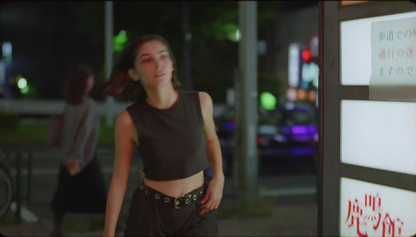 Portrait of a woman running into a establishment at night