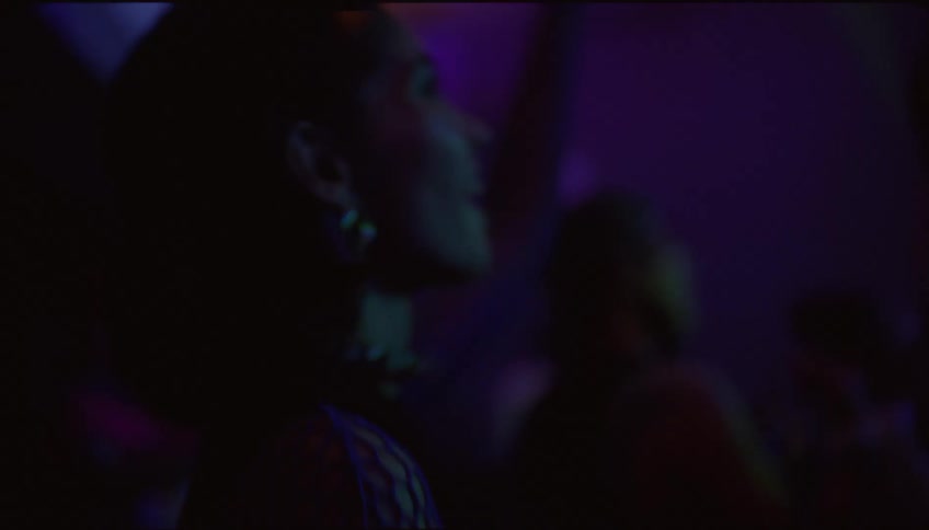 People enjoy a music show in a nightclub