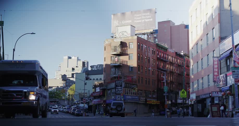 Panorama of a street in the city with vehicles moving and people walking