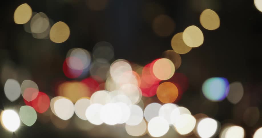 Blurry lights of traffic in the city streets at night