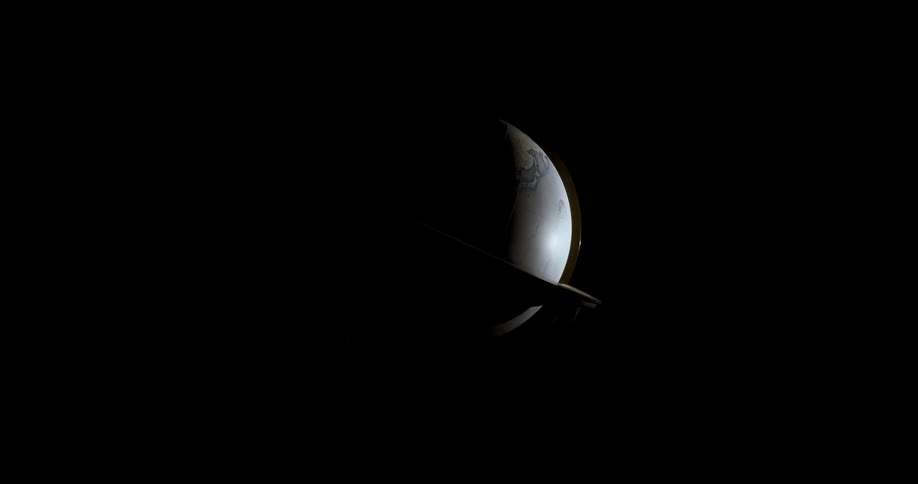 A globe of planet earth rotating in a dark environment