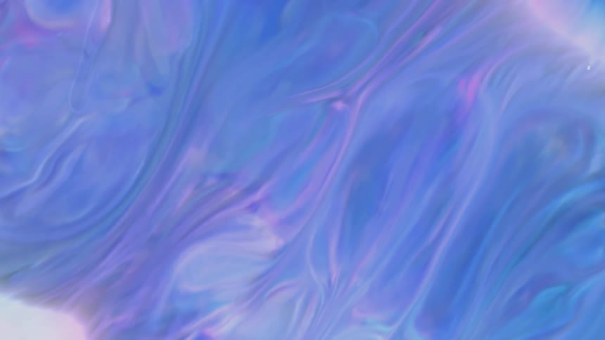 Dense and abstract blue and purplecolored liquid in slow motion
