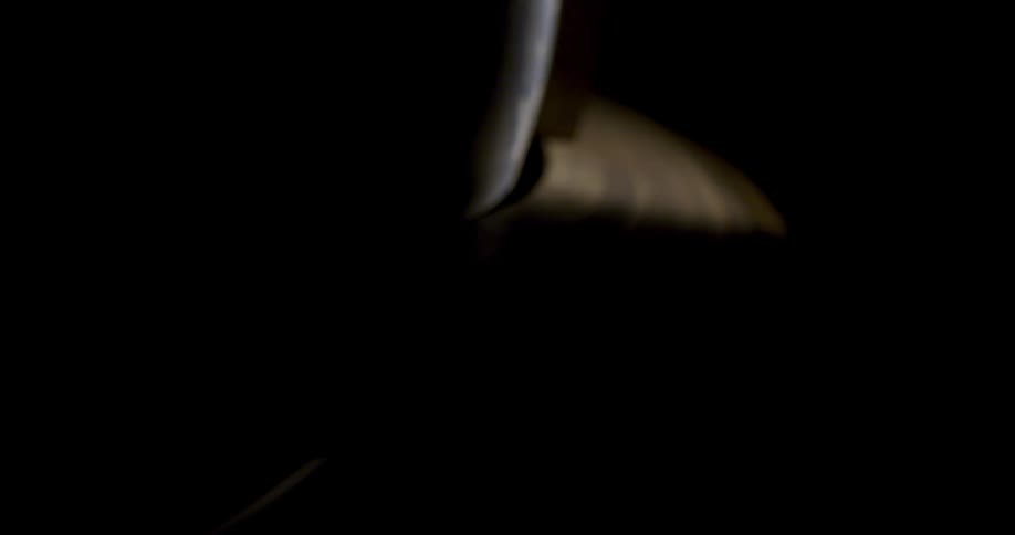 Earth globe spinning on a dimly lit room