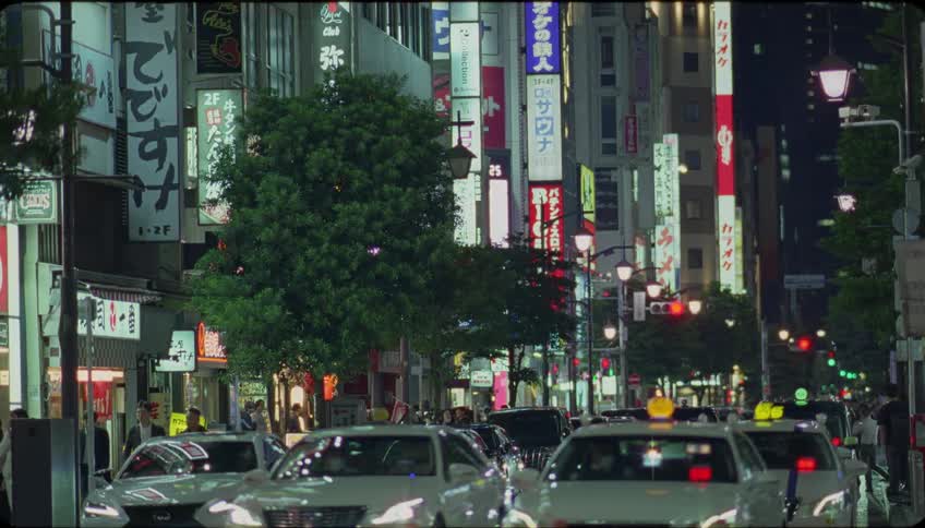 Cars driving on the city streets at night
