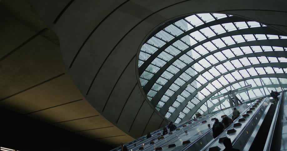 People using the escalators in canary wharf underground