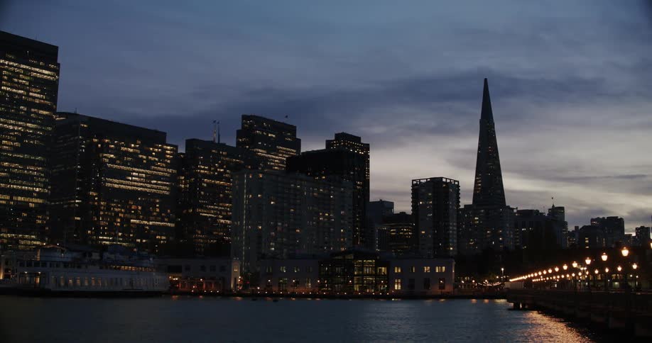 View of a metropolis facing a lake at night