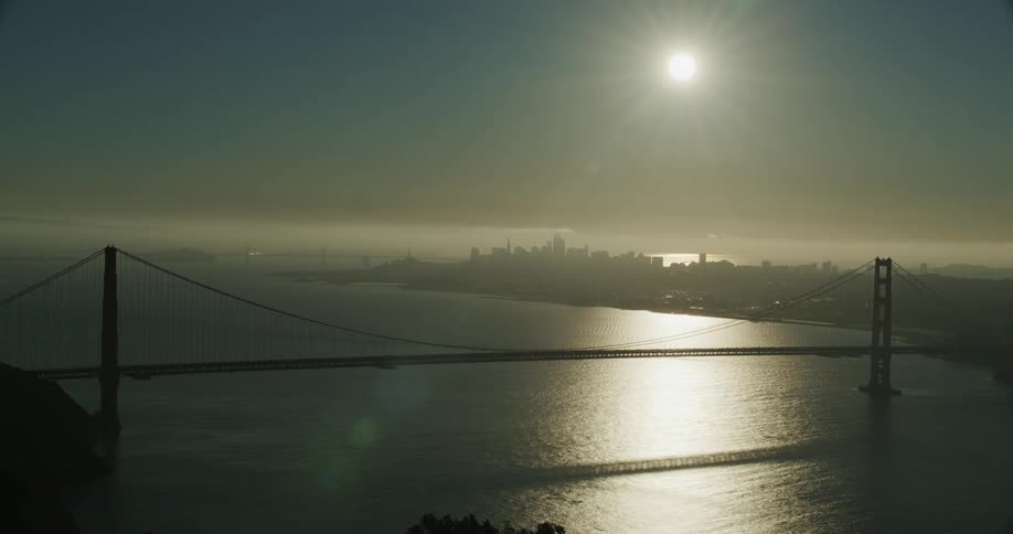 Bridge over a river next to the city at daytime