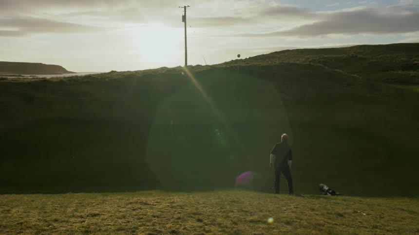 Man playing golf on the golf course at morning