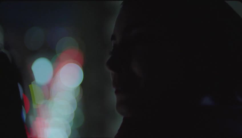 Silhouette of friends talking in the city at night