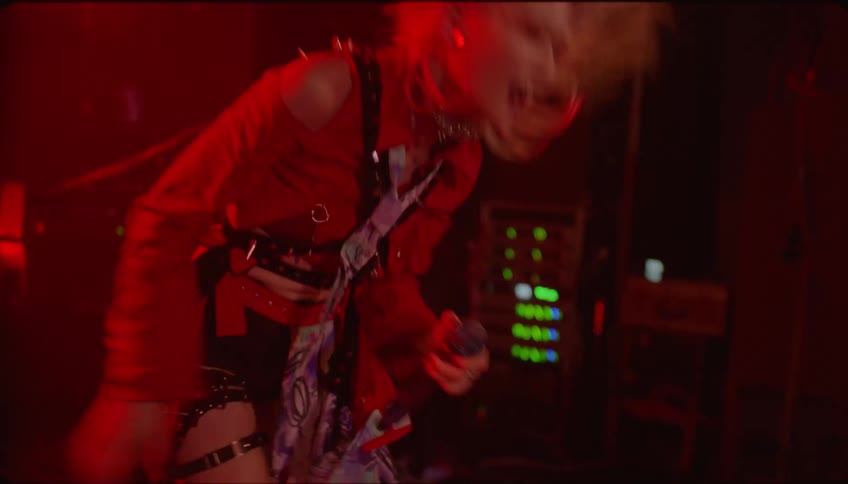 Woman enthusiastically performing for the audience in a nightclub