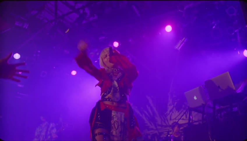 A woman is singing on stage