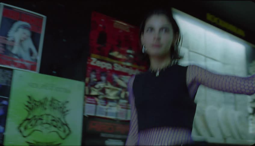 Young fashionable modern woman walking down the stairs of a club