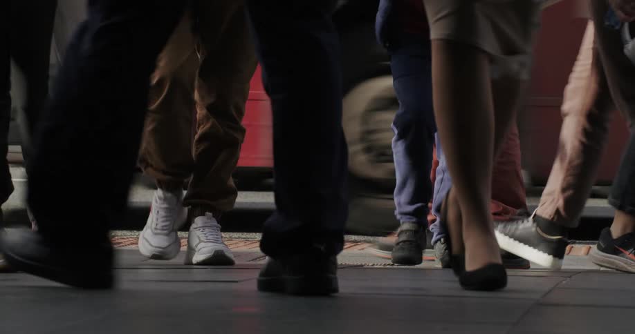 Pedestrians walking on a busy city street