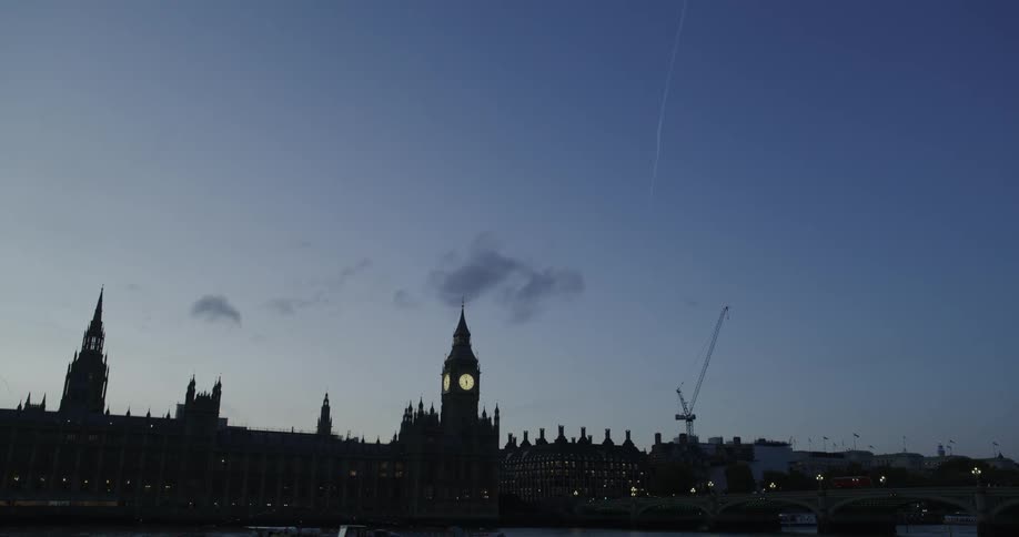 A silhouette of several buildings in one morning and the sky is very blue