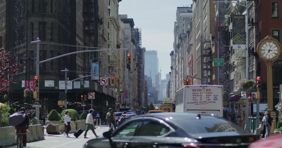 Pedestrians and traffic in a busy city street